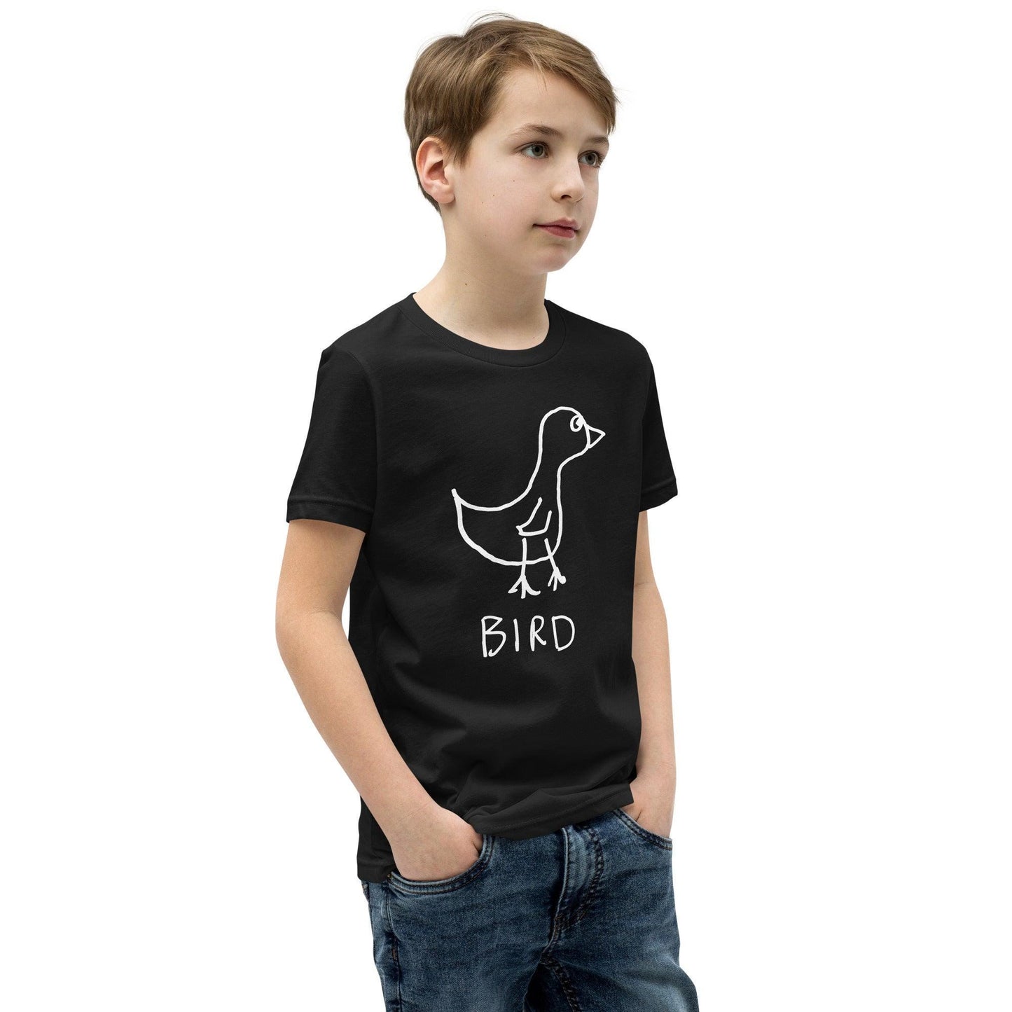 Young boy wearing a black t-shirt featuring a crude marker drawing of a bird with the word "Bird" underneath