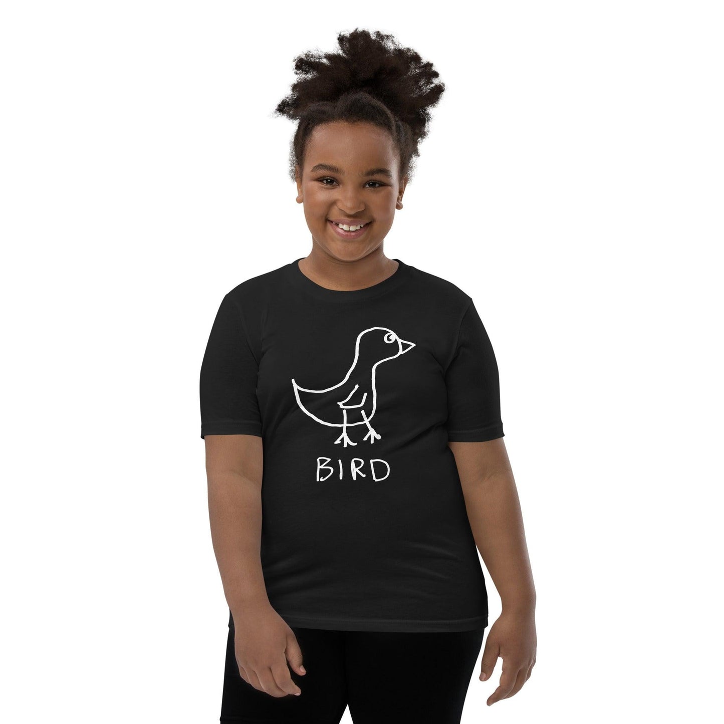 Young girl wearing a black t-shirt featuring a crude marker drawing of a bird with the word "Bird" underneath