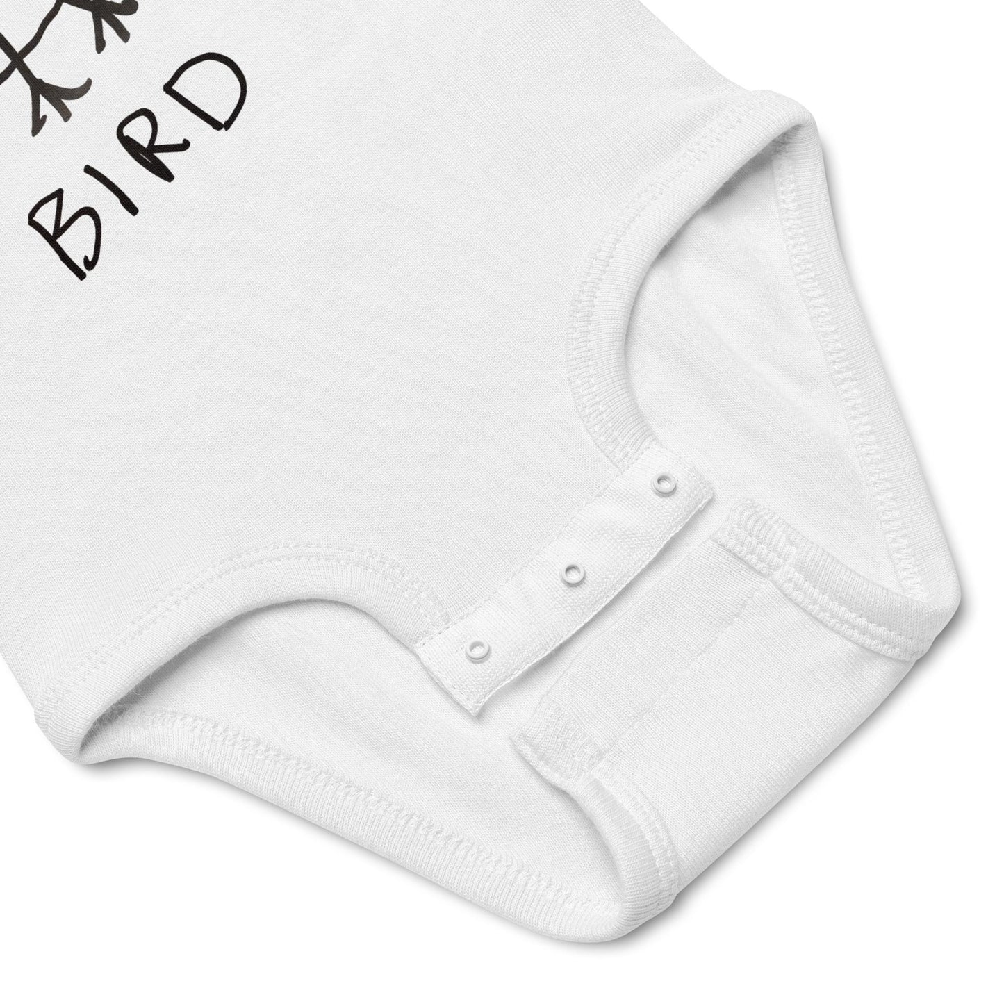 White baby onesie with a small bird design on a white background