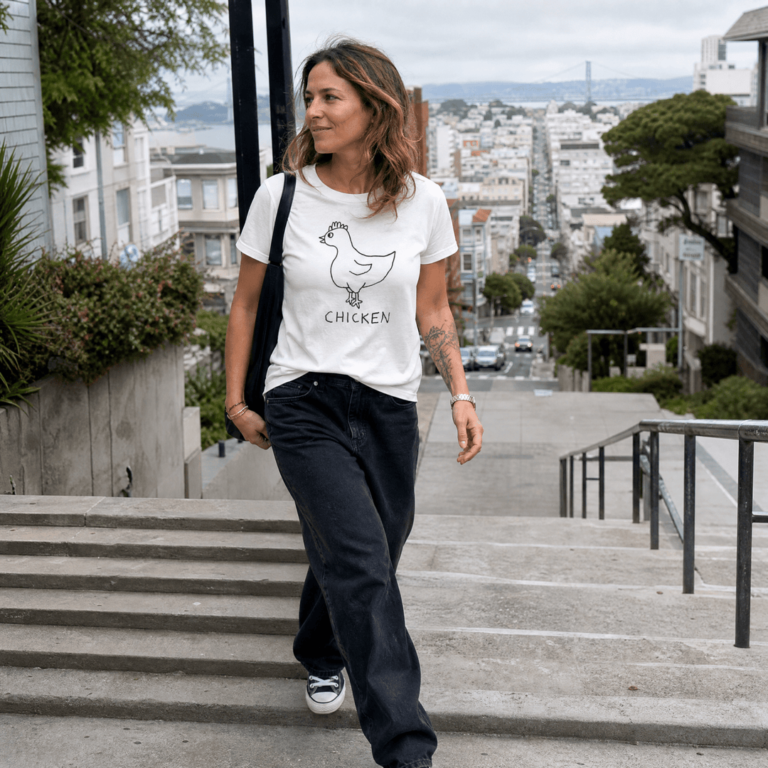 Woman walking down a San Francisco street wearing a lo-fi Chicken V-Neck Tee
