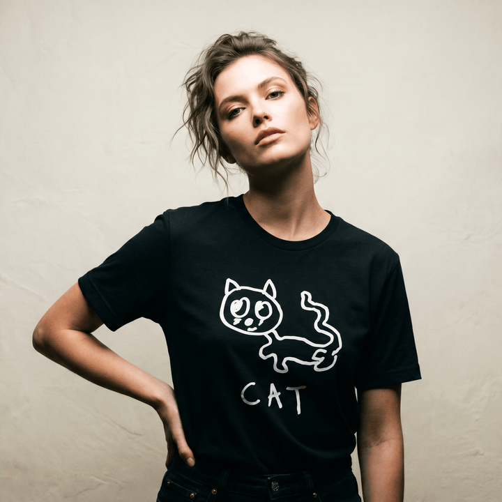 Woman in a minimalist studio portrait wearing a lo-fi Cat Women&
