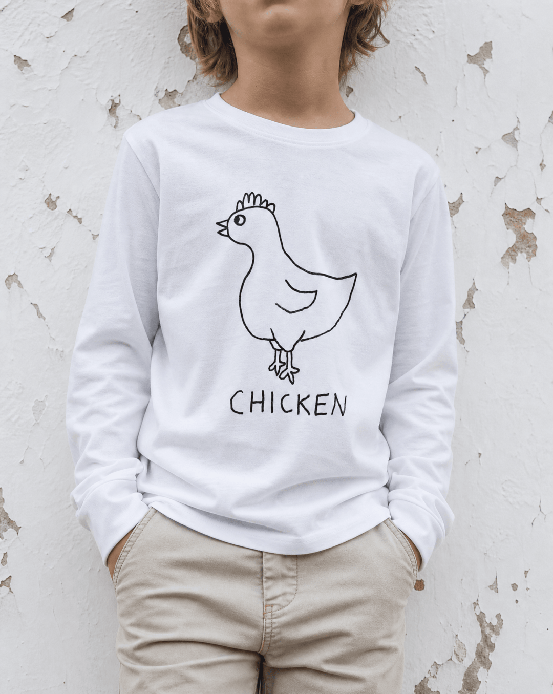 Woman street-style torso shot in a lo-fi Chicken Long Sleeve Tee in white