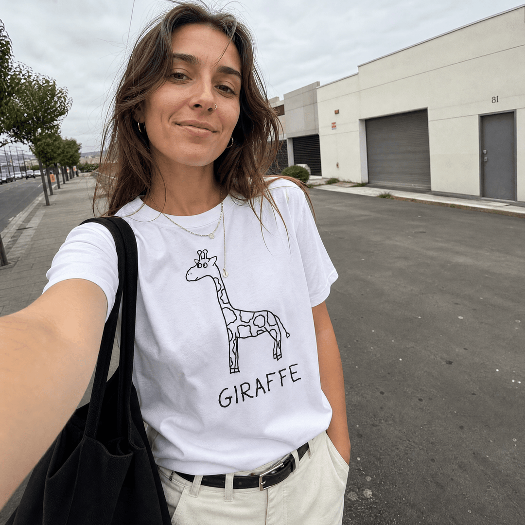 Woman taking a selfie on an urban street wearing a lo-fi Giraffe Women&
