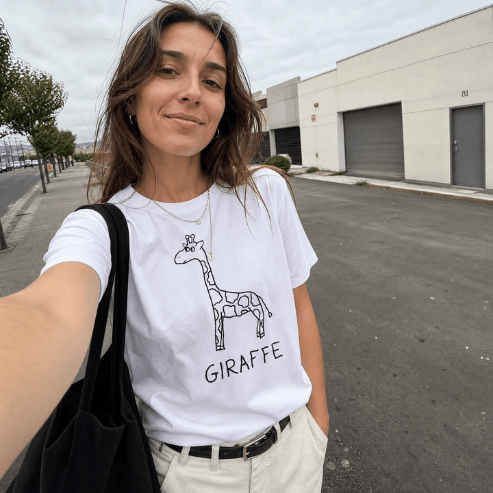 Woman taking a selfie on an urban street wearing a lo-fi Giraffe Women&