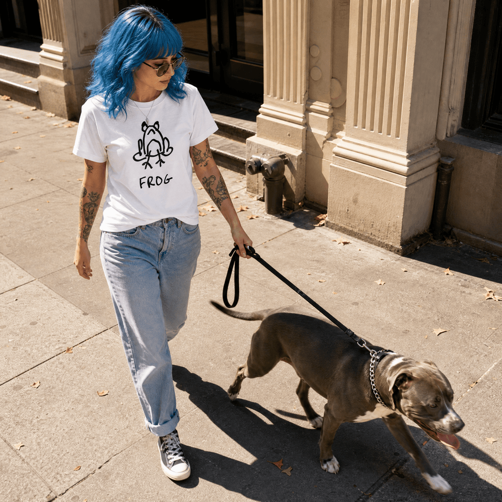 Woman walking a dog on a city street in a lo-fi Frog Women's Relaxed T-Shirt in white