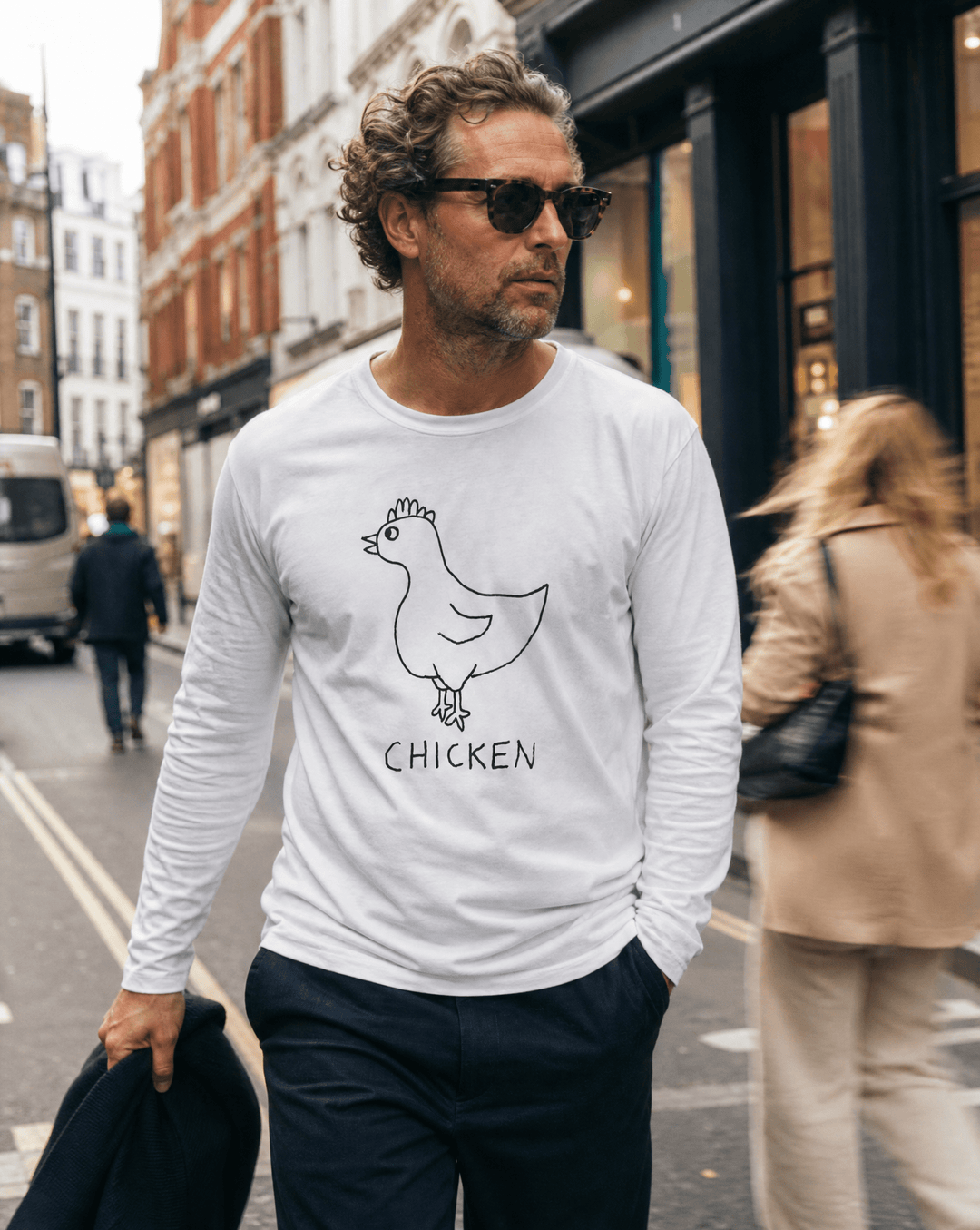 Woman walking a SoHo shopping street in a lo-fi Chicken Long Sleeve Tee in white