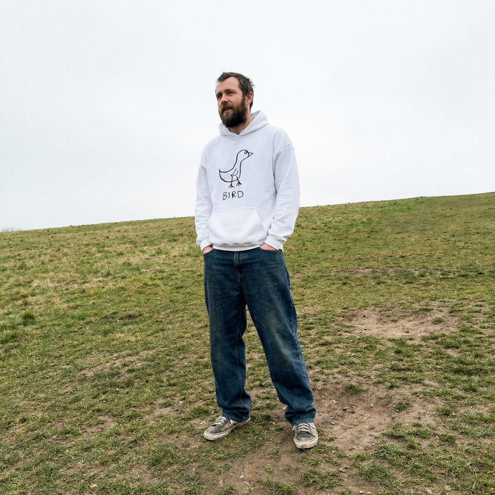 Bird hoodie worn outdoors – minimalist lofi bird hoodie in natural setting