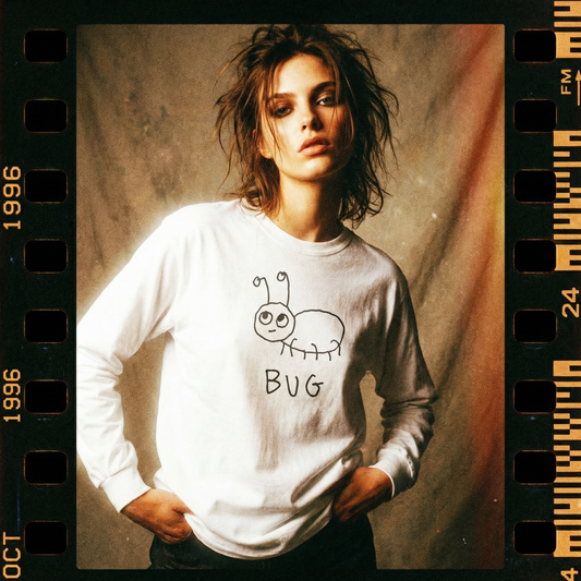 Model in a bug graphic long sleeve in a macro-inspired, grainy 90s photo shoot