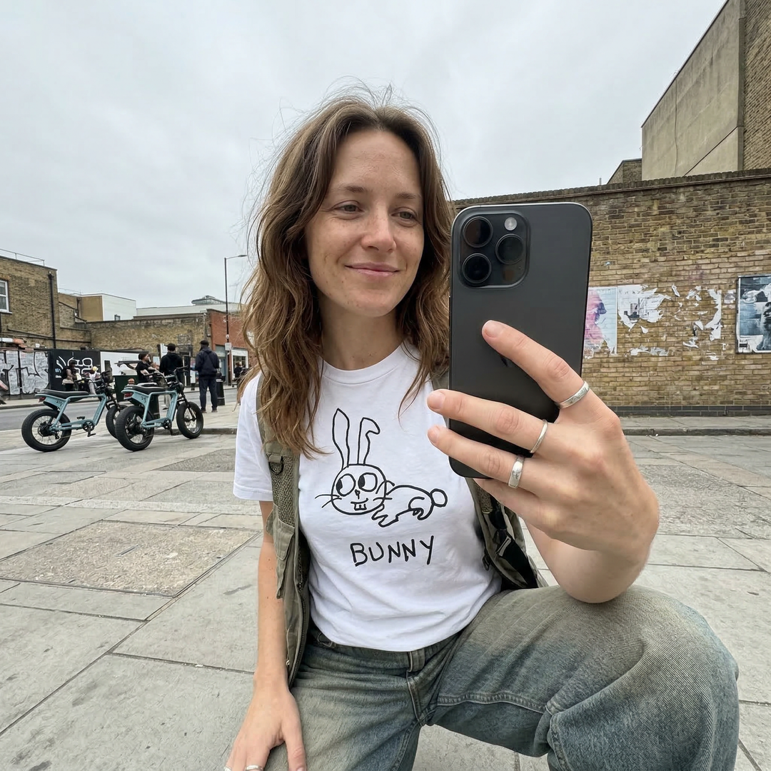 Bunny graphic tee worn on city street by woman taking a selfie – lofi animal shirt streetwear style
