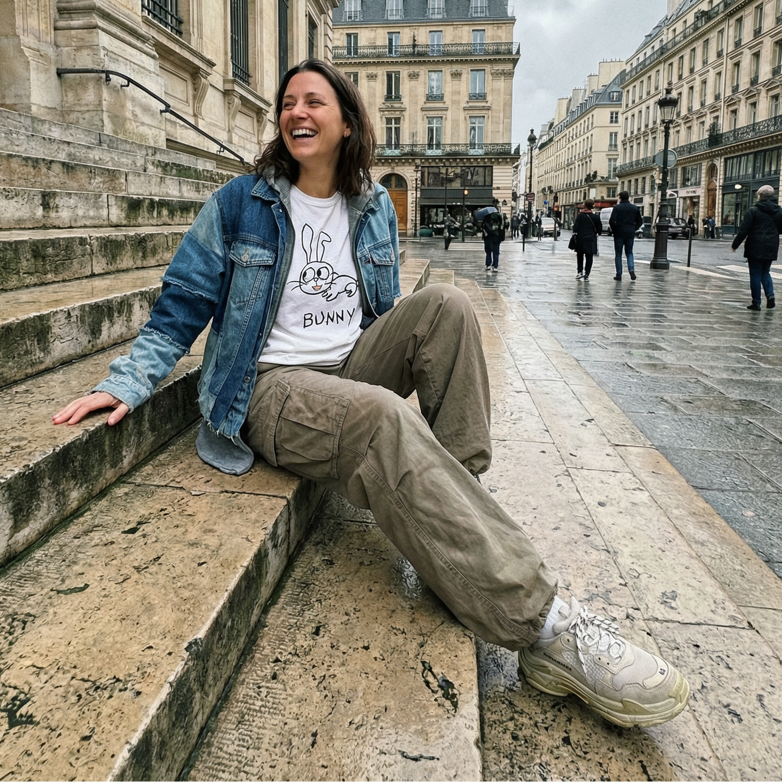 Bunny graphic tee worn on by woman sitting on a stoop on a Paris streetlofi animal shirt streetwear style