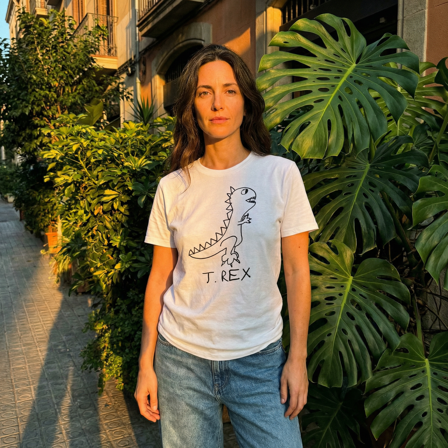 T-Rex graphic tee worn by woman in Barcelona setting – lofi dinosaur shirt streetwear style