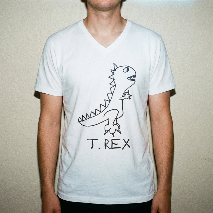 Model in T-Rex v-neck tee, bold stance, clean studio background
