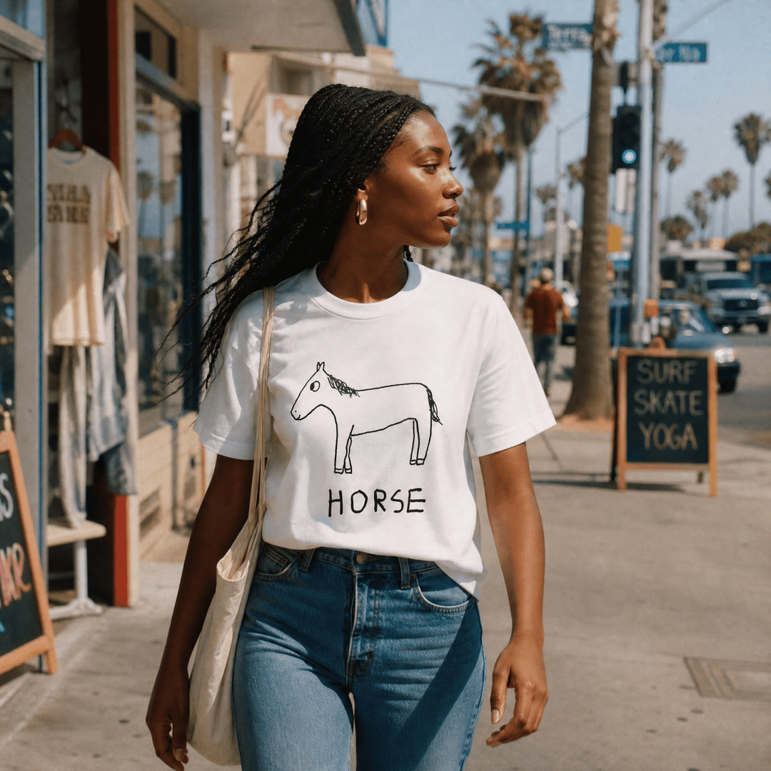 Woman walking a palm-lined beach town street in a lo-fi Horse Women&