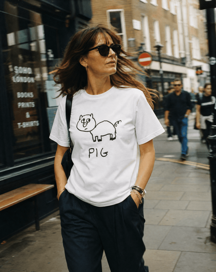 Woman walking a SoHo shopping street wearing a lo-fi Pig Women&
