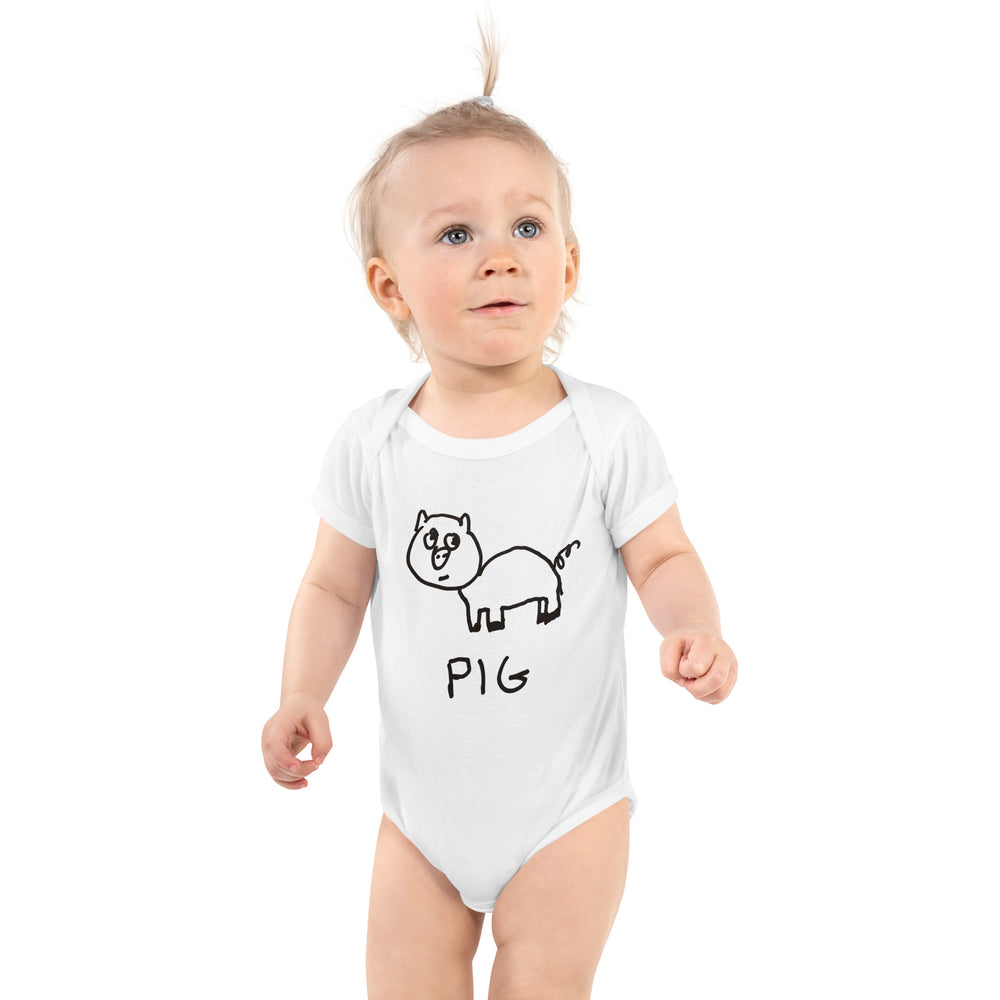 cute baby wearing a white baby onesie with a hand drawn pig and the word "PIG" drawn on it. 