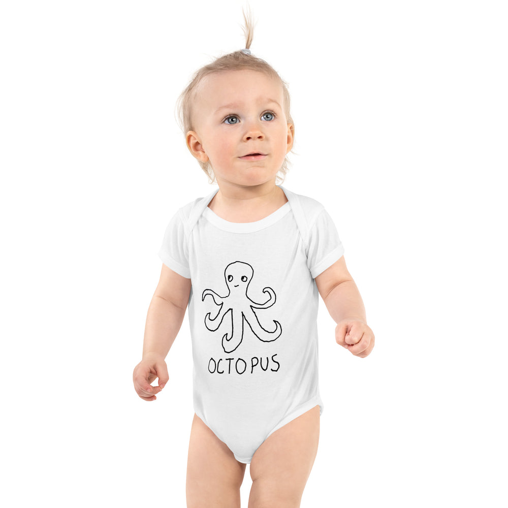 cute baby wearing a white baby onesie with a hand drawn octopus and the word "OCTOPUS" on the front.