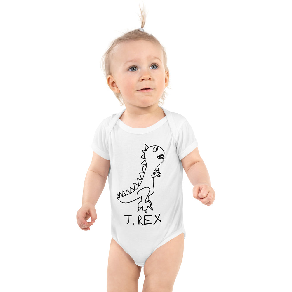 Cute baby wearing white infant bodysuit with T Rex drawing on it. dinosaur
