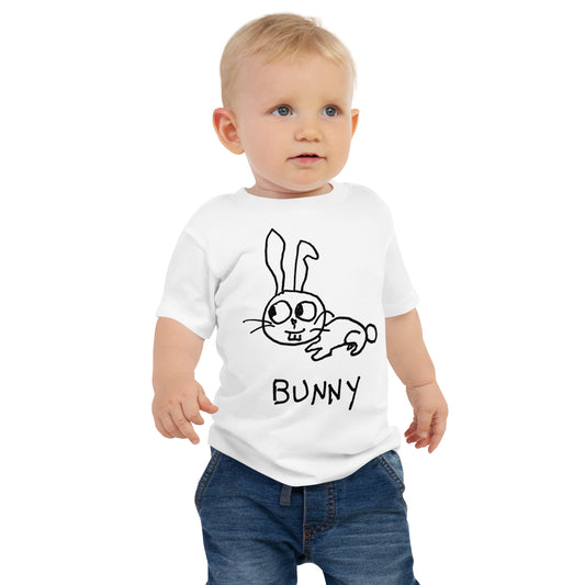 Cute toddler wearing white t-shirt with hand drawn bunny graphic and text. 