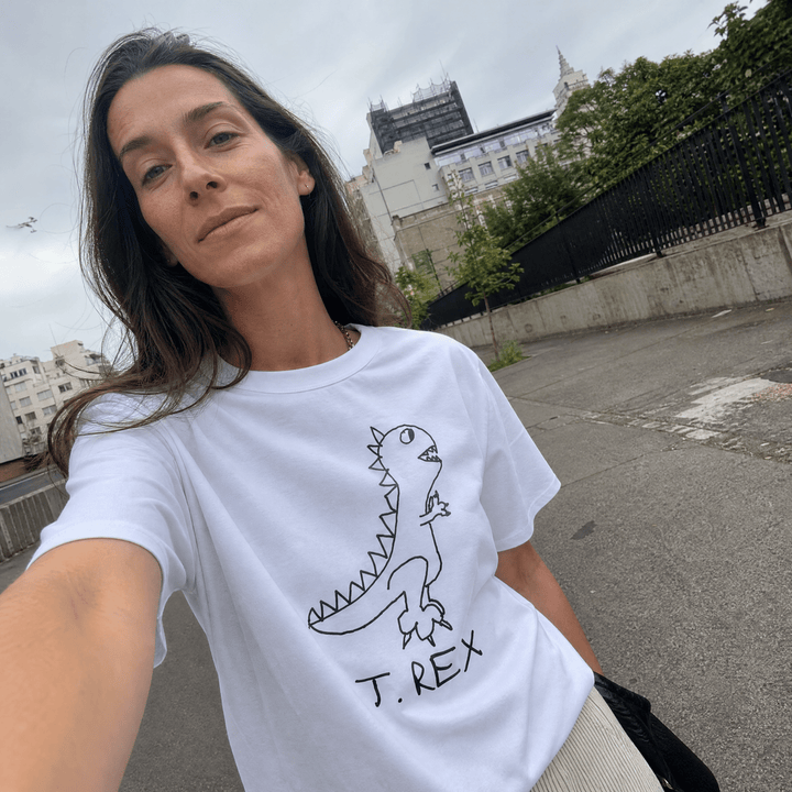 Woman taking a street selfie in a lo-fi T. Rex Women&