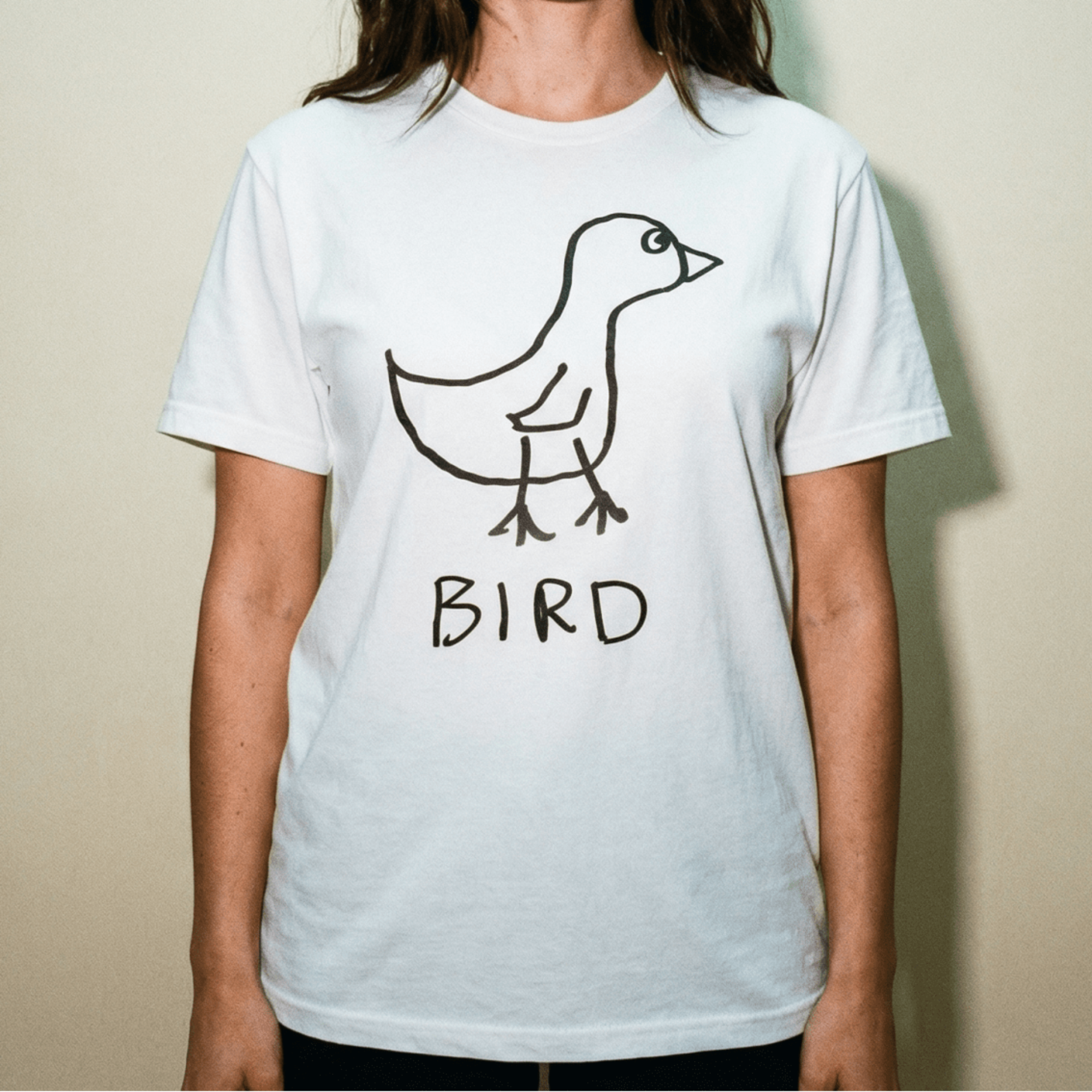 Woman in a studio wearing a lo-fi Bird Classic Tee