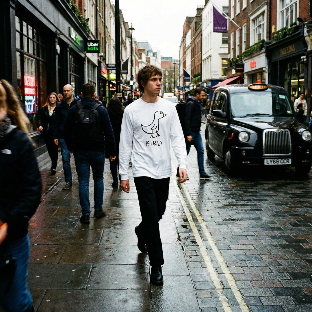 Person in a bird graphic long sleeve on a London rooftop terrace in Soho
