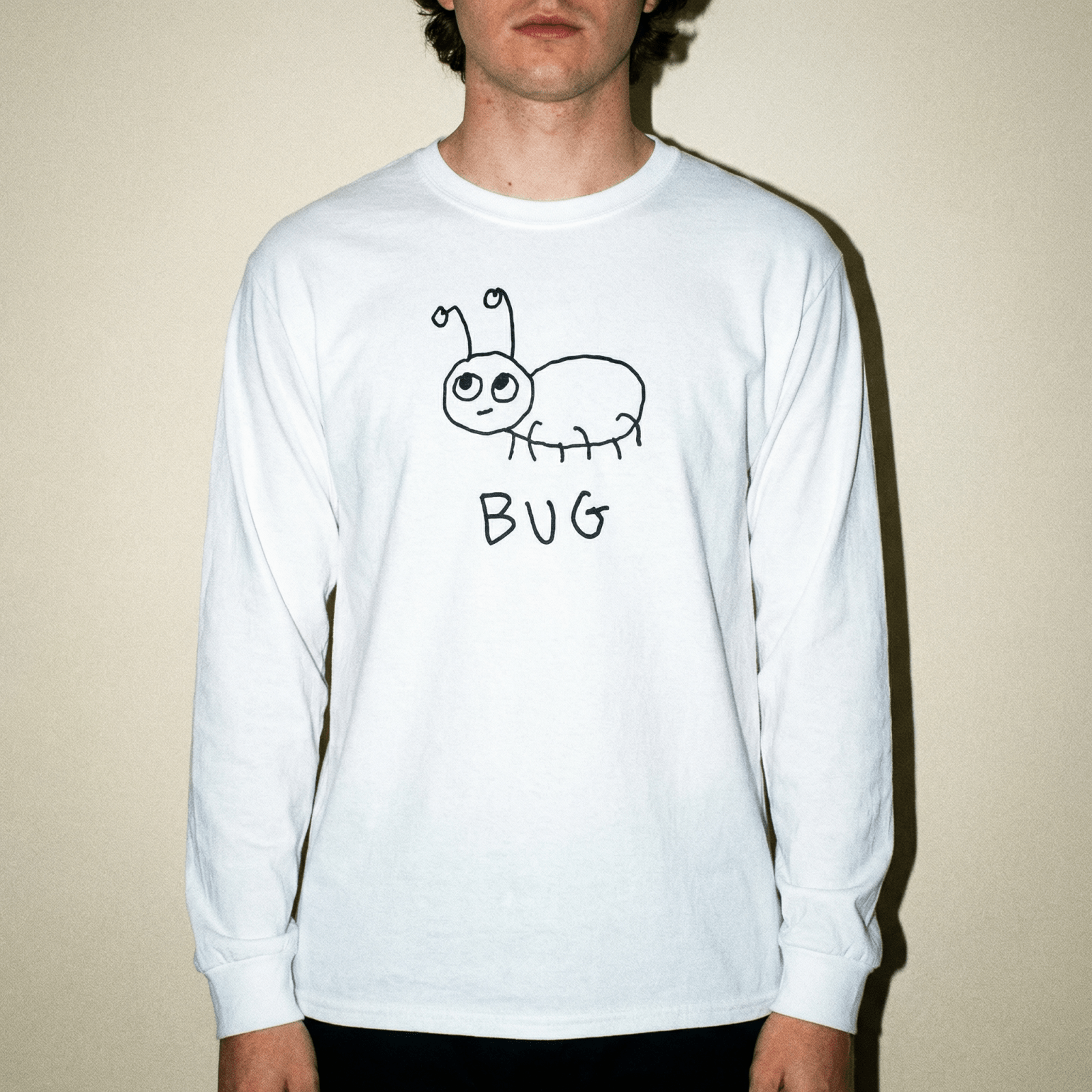 lo-fi Bug Long Sleeve Tee — hand-drawn bug graphic on a white long-sleeve t-shirt