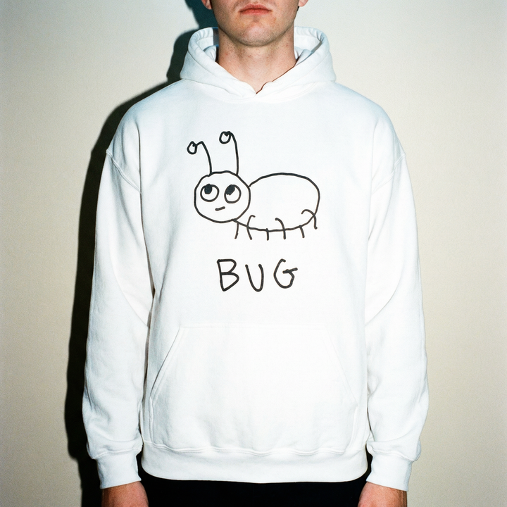 Man wearing a white hoodie with a quirky minimalist lofi BUG drawing and text. 