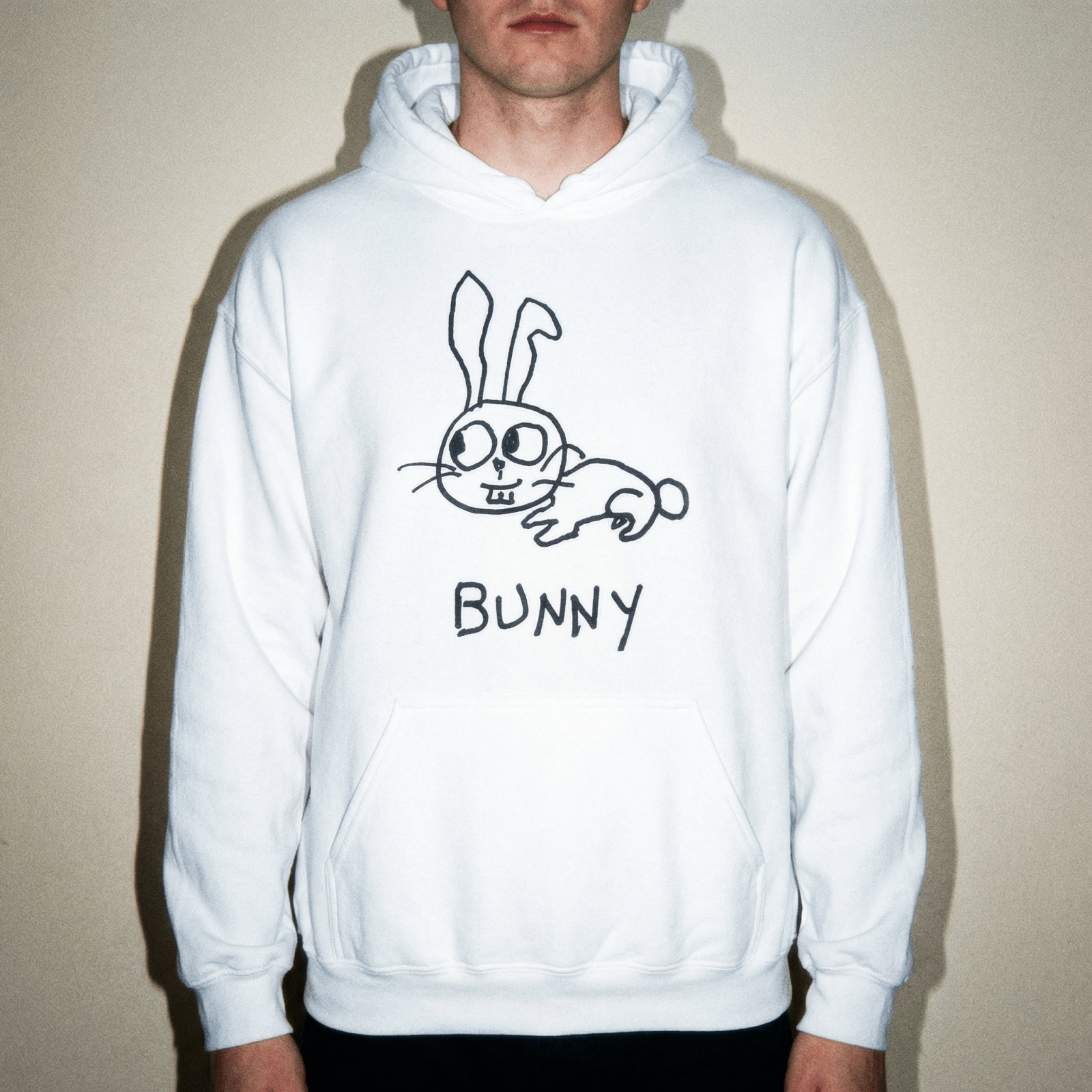 Studio torso view of a man wearing a lo-fi Bunny Hoodie