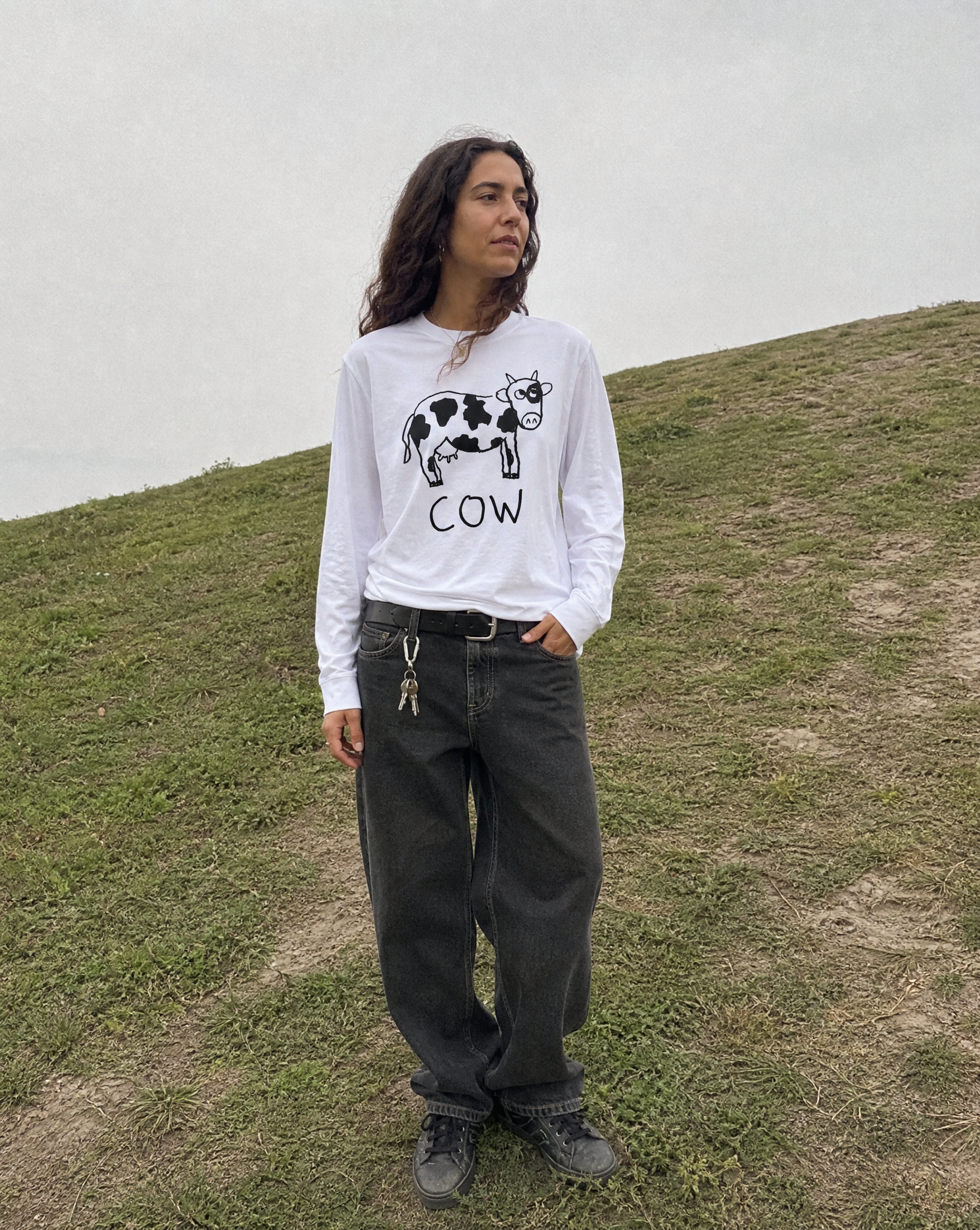 lo-fi Cow Long Sleeve Tee — hand-drawn cow graphic on a white long-sleeve t-shirt