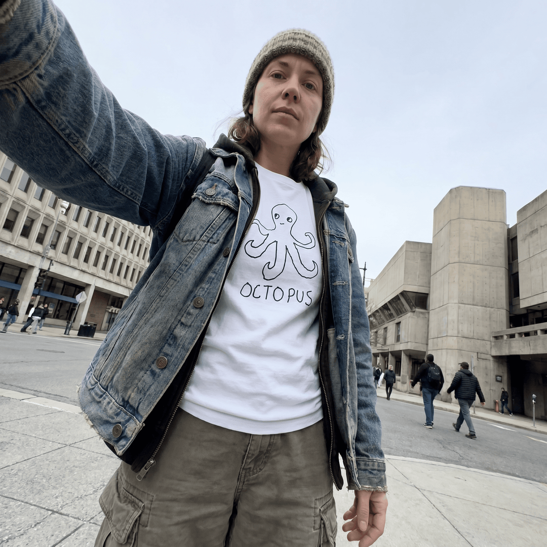Woman taking a selfie on an urban street wearing a lo-fi Octopus Women&