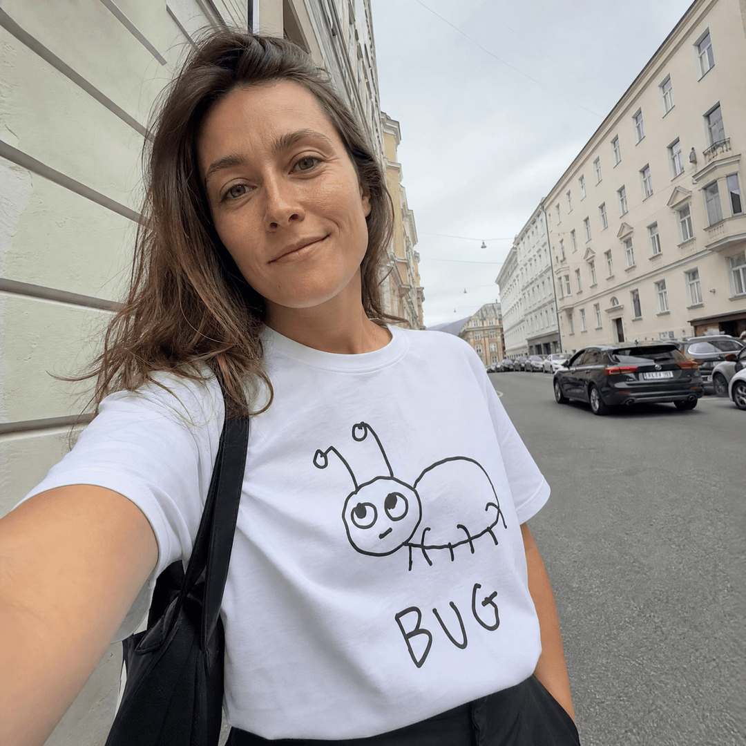 Woman taking a street selfie in a lo-fi Bug Women&