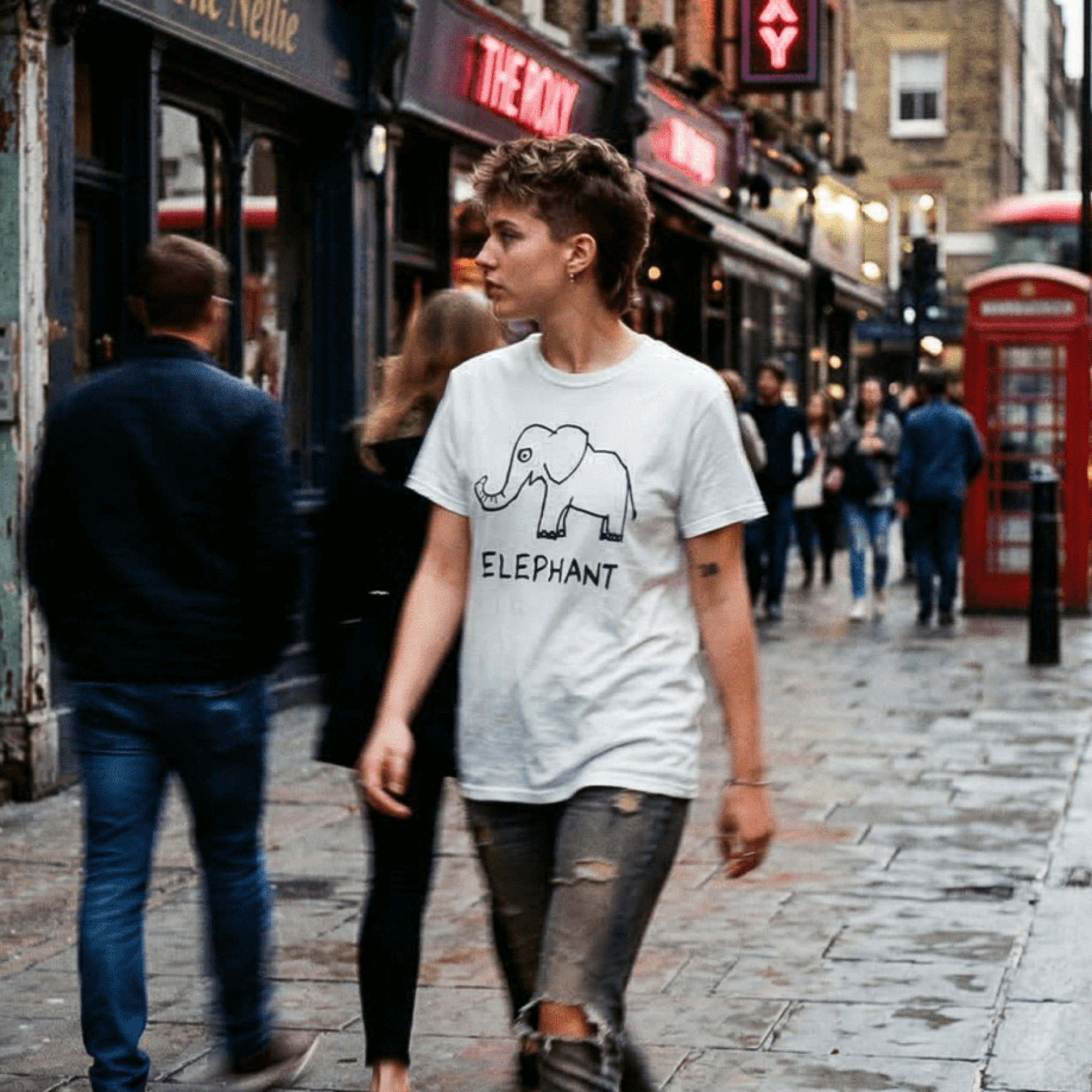 Woman walking a rainy London street wearing a lo-fi Elephant Classic Tee