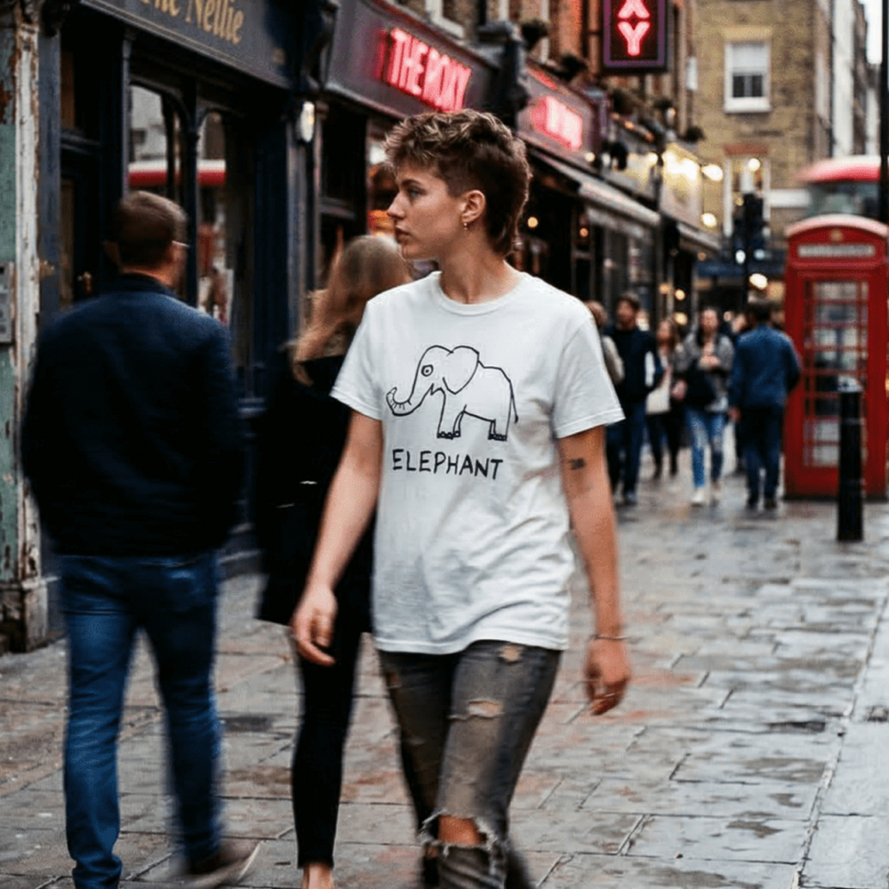 Woman walking a rainy London street wearing a lo-fi Elephant Classic Tee