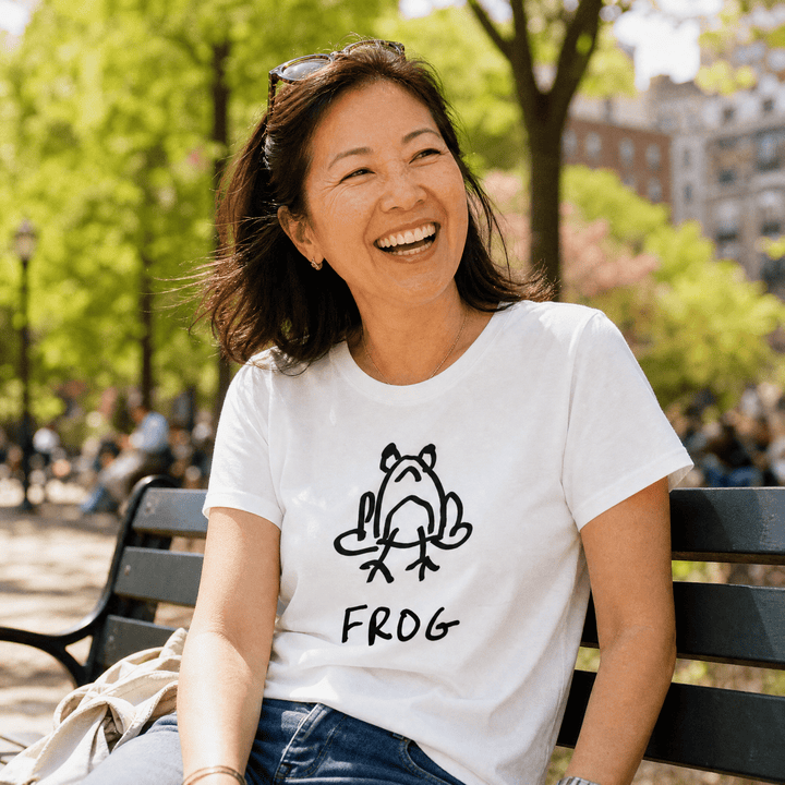 Woman seated on a park bench in a lo-fi Frog Women&