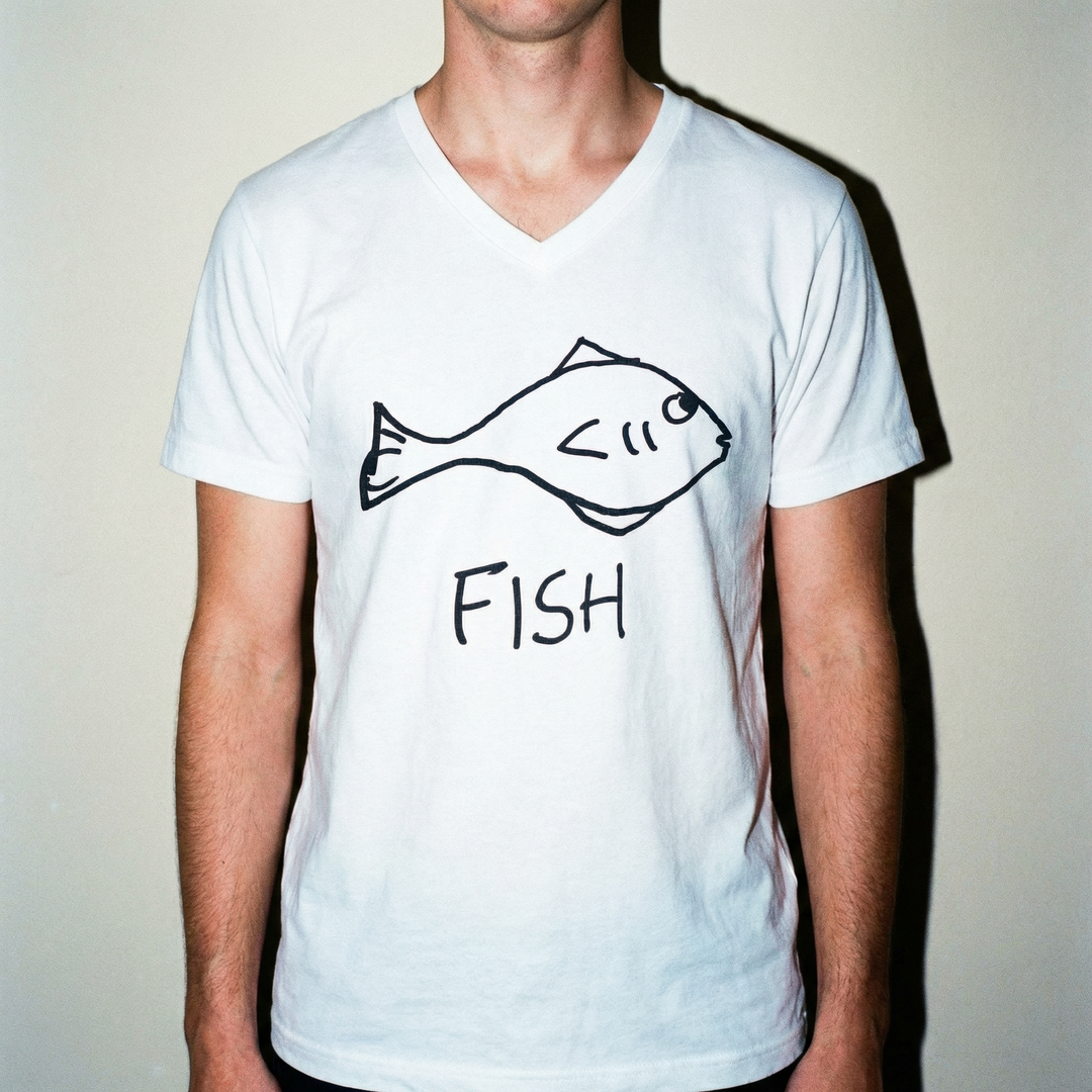 Model in fish v-neck tee, cool-toned studio backdrop, clean and simple