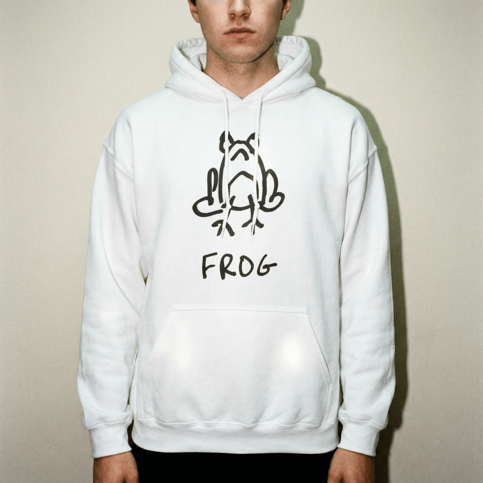 Studio portrait of a man wearing a lo-fi Frog Hoodie