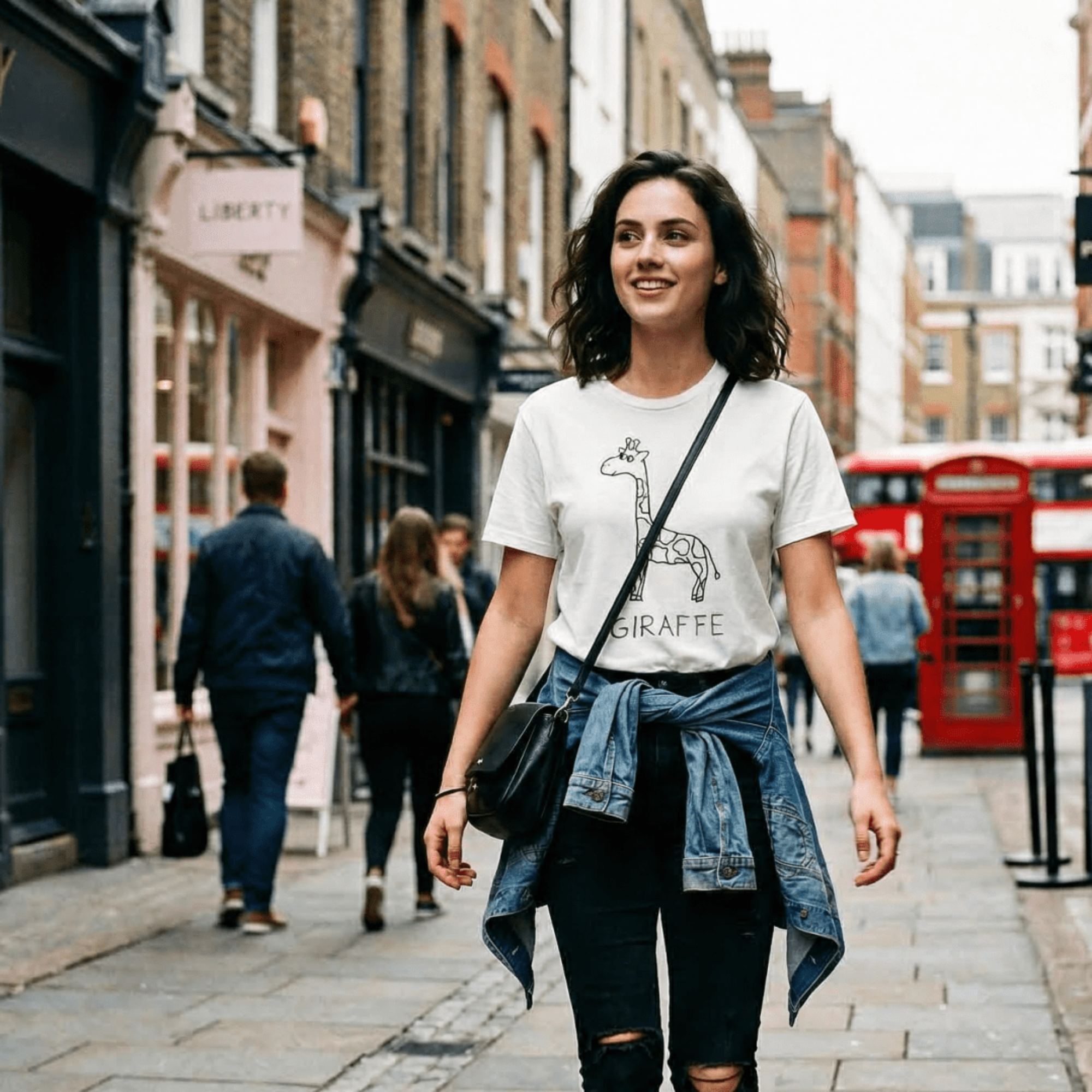 Woman walking a London high street wearing a lo-fi Giraffe Classic Tee in white