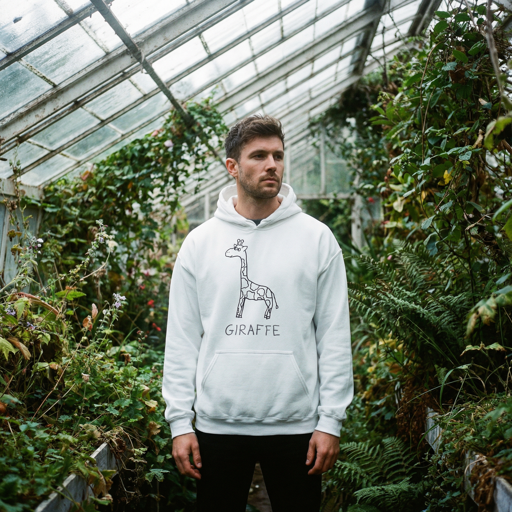 Giraffe graphic hoodie worn in greenhouse setting – lofi animal streetwear