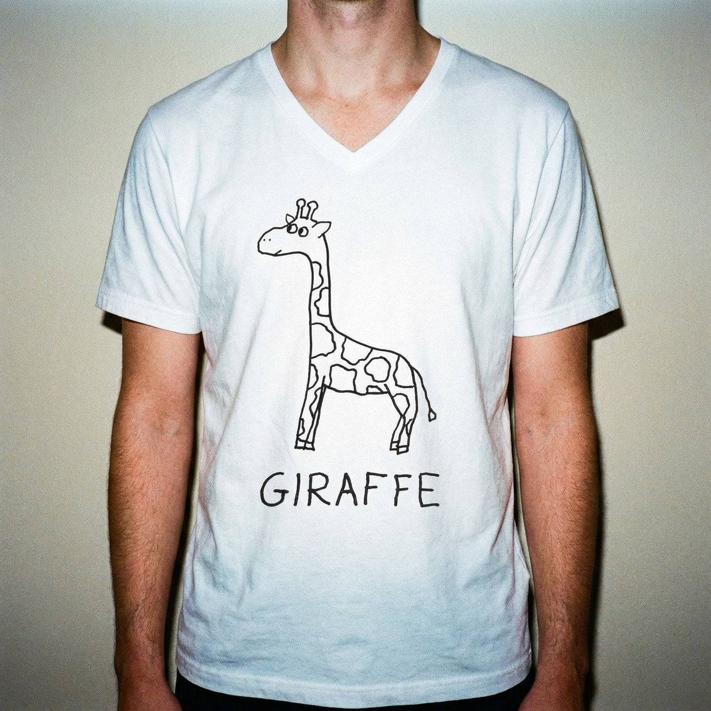 Model in giraffe v-neck tee, full-length shot, clean minimal background