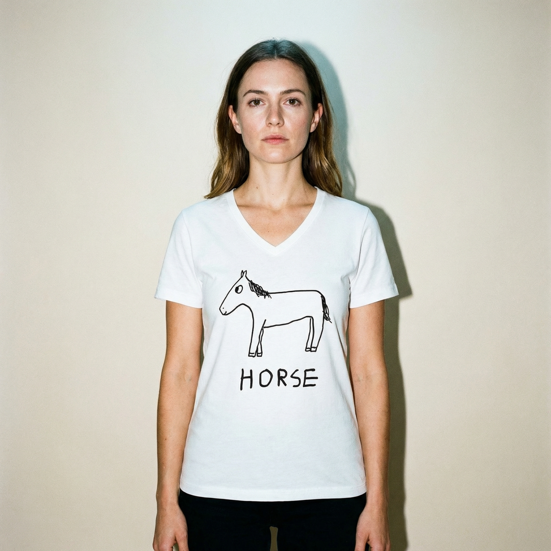 Model wearing the horse v-neck tee, upright posture, pale studio backdrop