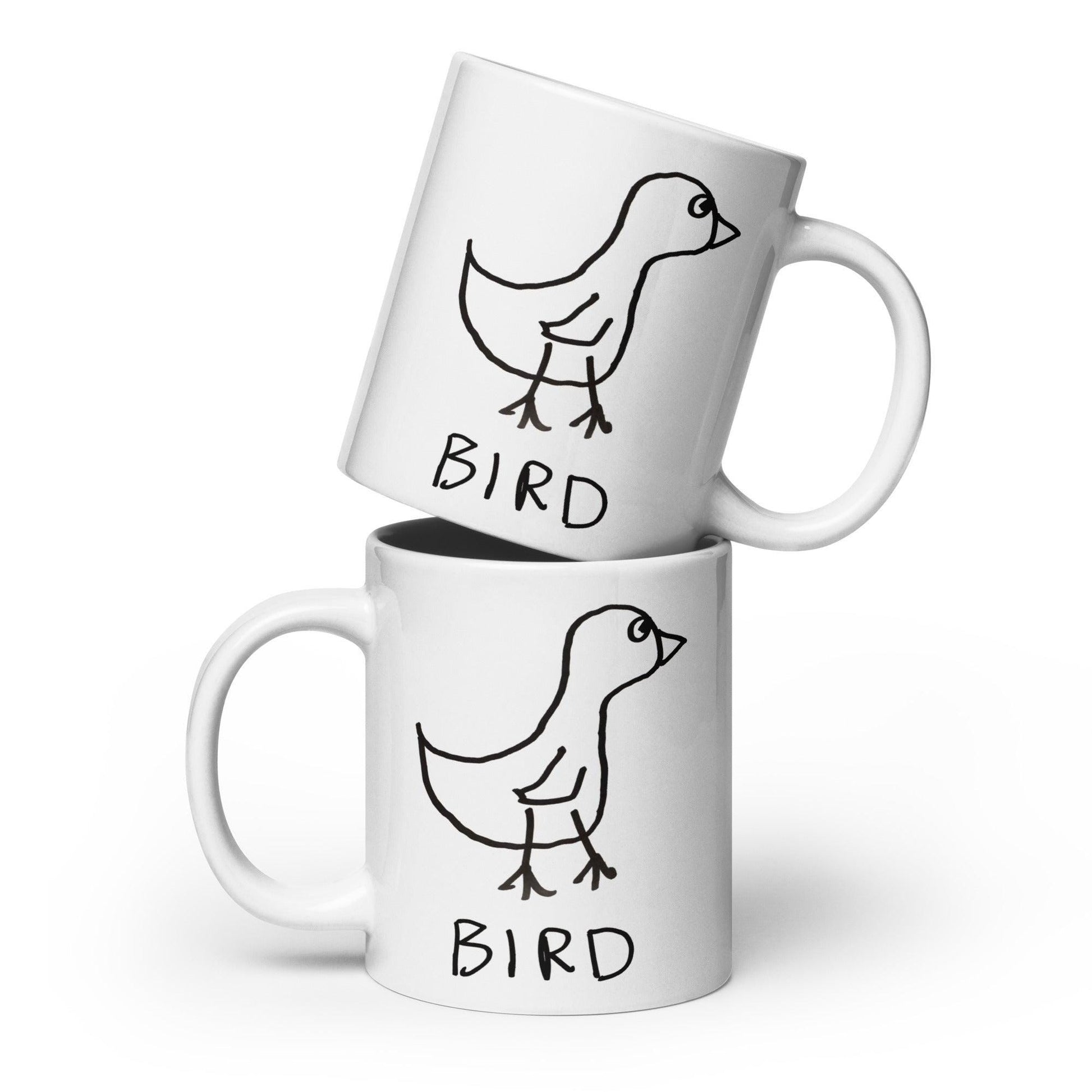 Two coffee mugs stacked on a white background, each  featuring a crude marker drawing of a bird with the word "Bird" underneath