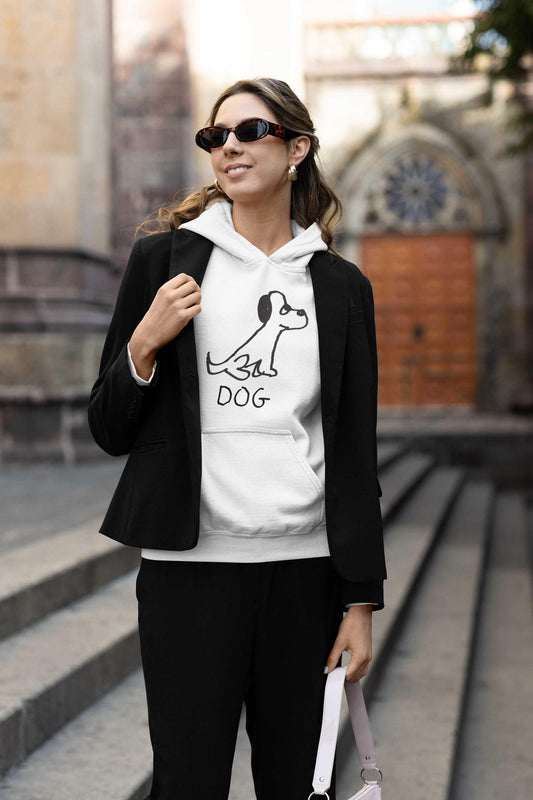 Hip young woman in city wearing a jacket over a white pullover hoodie  Featuring a crude marker black and white marker drawing of a cute dog with the word "DOG" handwritten underneath