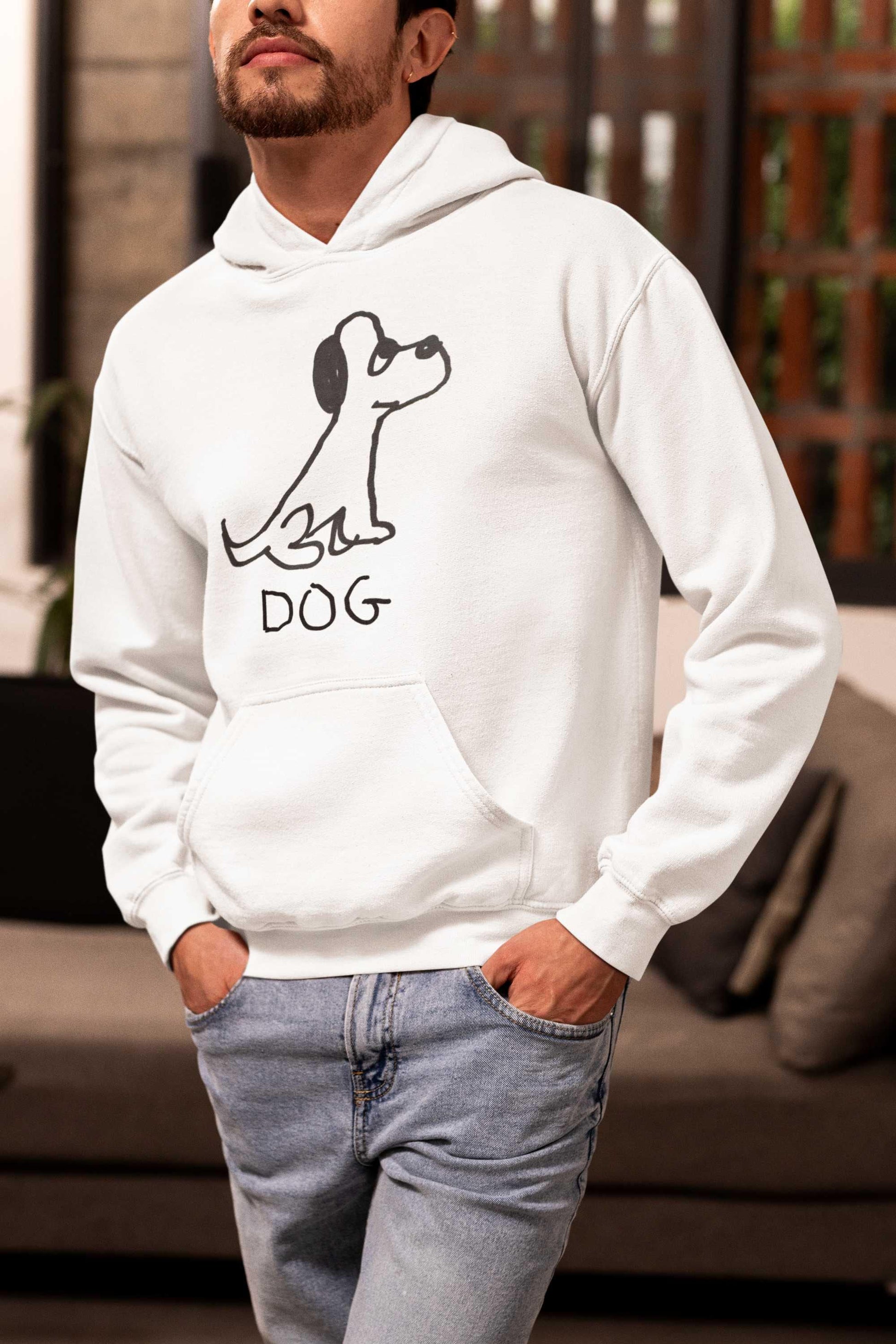 man wearing jeans and a white pullover hoodie sweatshirt  Featuring a crude marker black and white marker drawing of a cute dog with the word "DOG" handwritten underneath