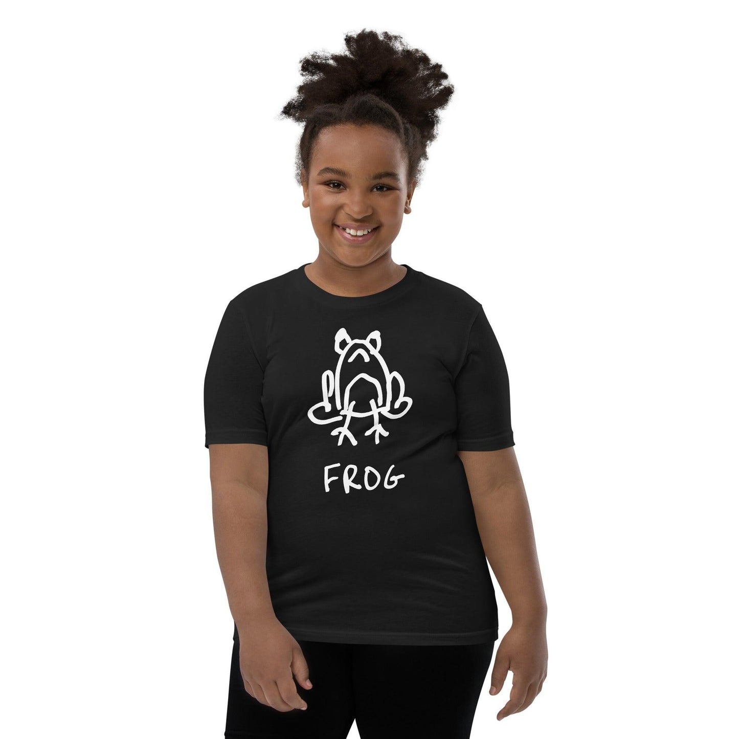 young girl wearing a black kids t-shirt featuring a crude but cute black and white marker marker drawing of a cute frog with the word “FROG” handwritten underneath
