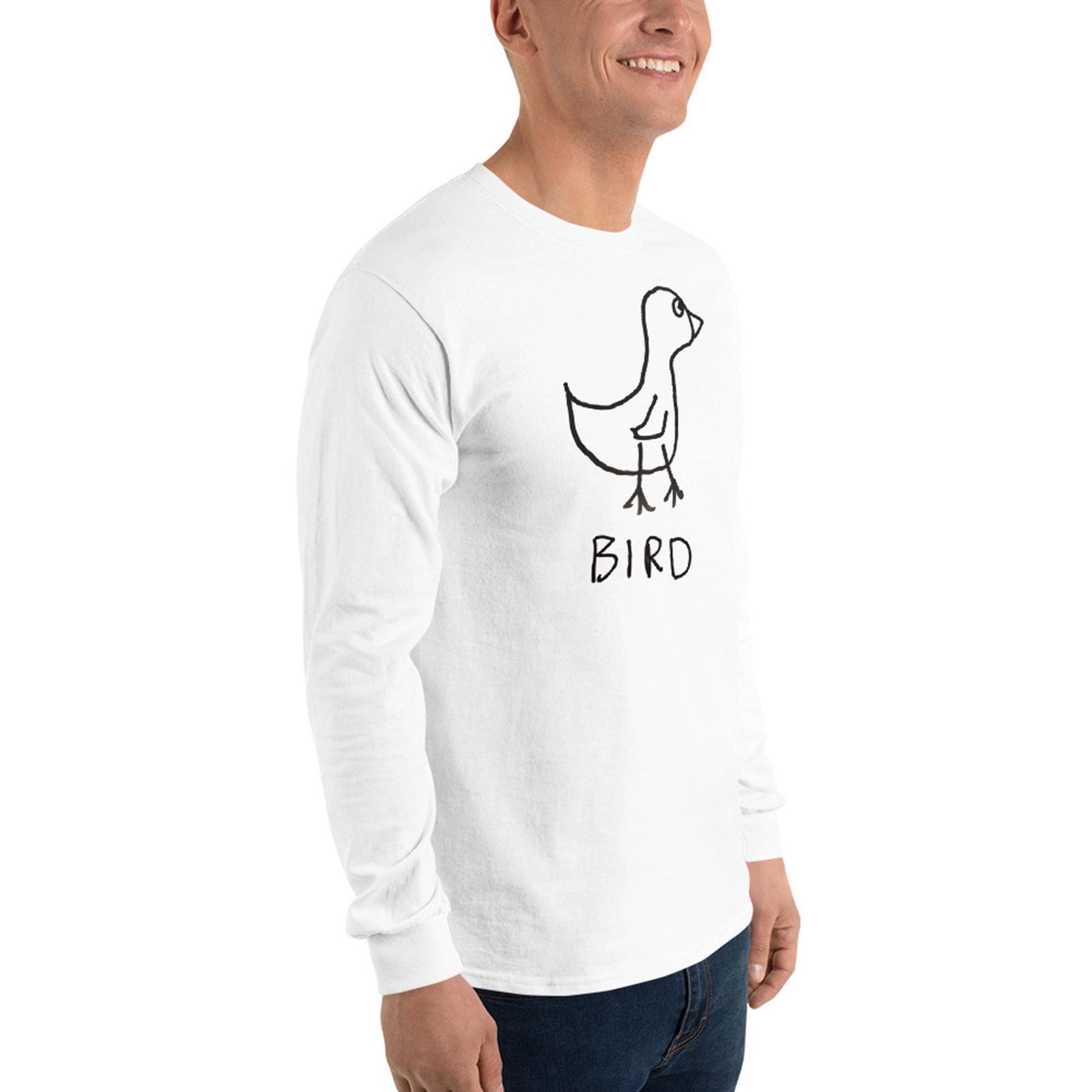 Person wearing a white long-sleeve shirt  featuring a crude marker drawing of a bird with the word "Bird" underneath