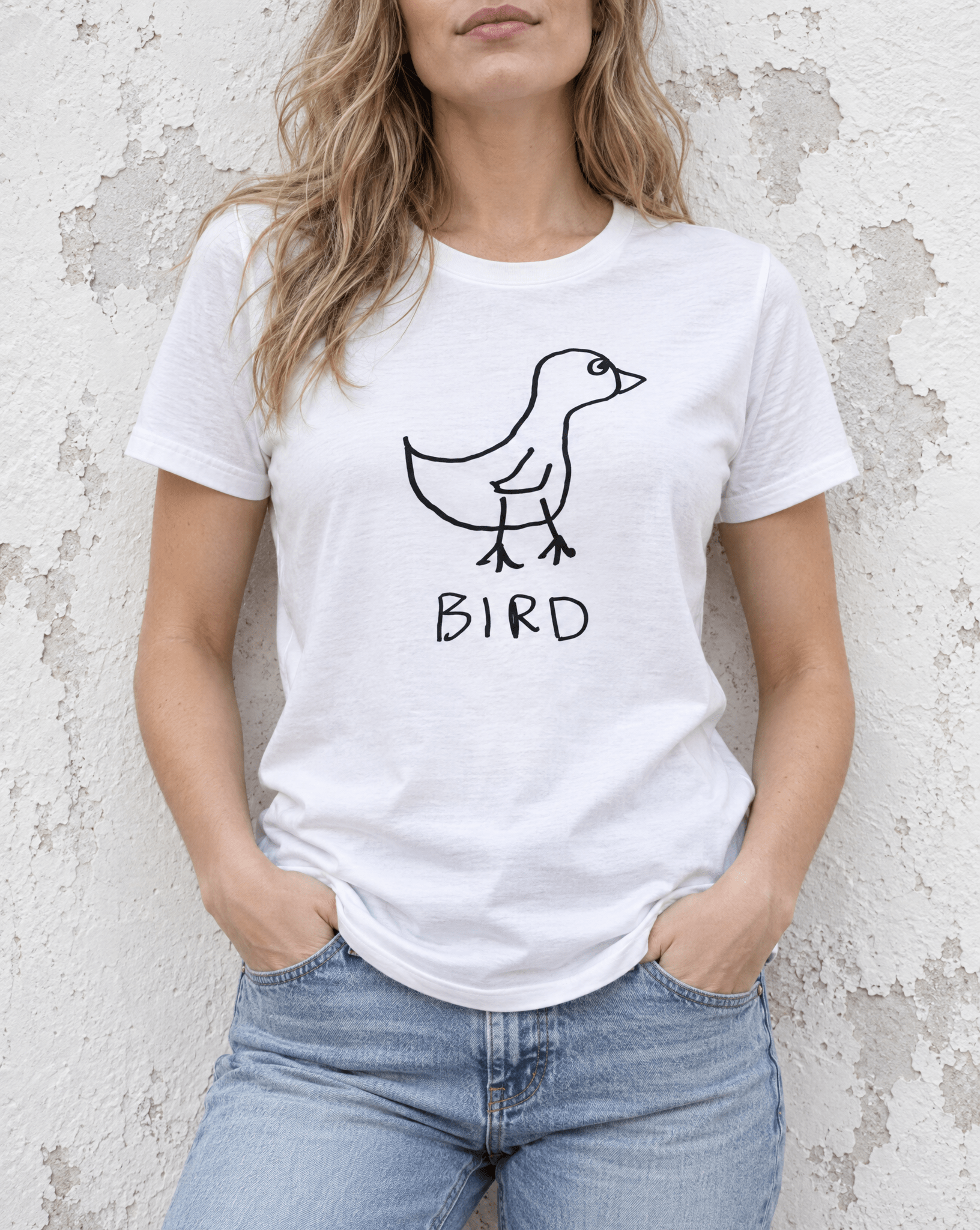 Sep 29 bird women's tee — urban torso lifestyle photo
