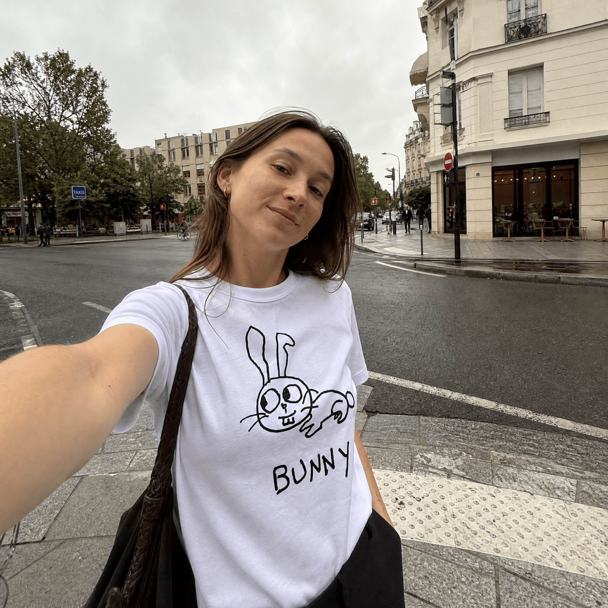 Woman taking a street selfie in a lo-fi Bunny Women's Relaxed T-Shirt in white