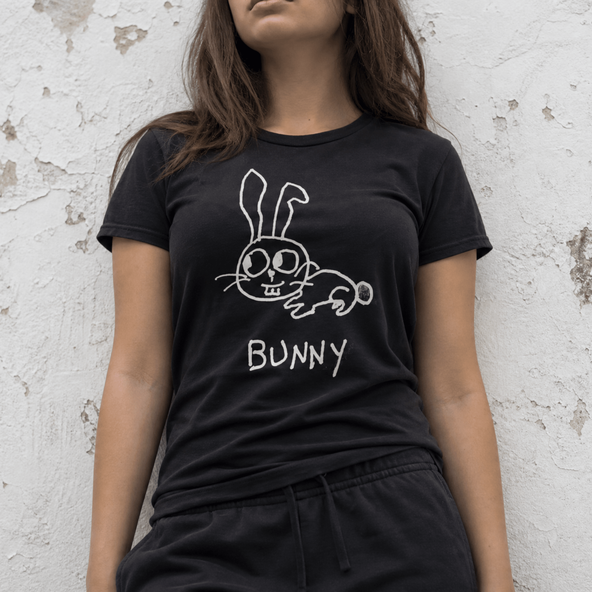 Woman street-style torso shot in a lo-fi Bunny Women's Relaxed T-Shirt in black