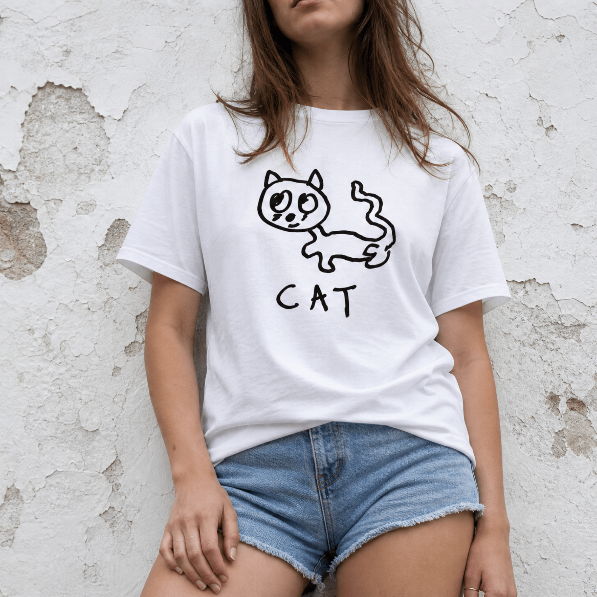 Woman street-style torso shot in a lo-fi Cat Women's Relaxed T-Shirt in white