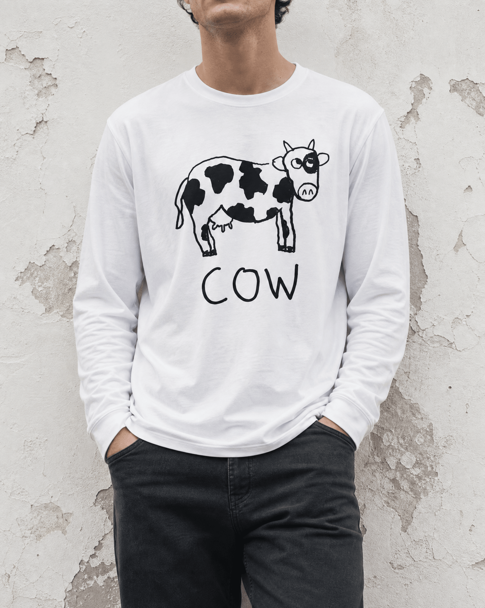Woman street-style torso shot in a lo-fi Cow Long Sleeve Tee in white